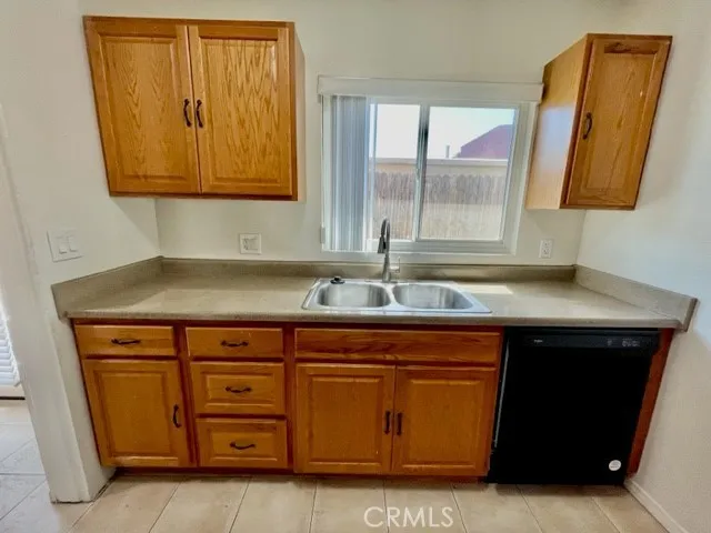 a kitchen with a sink and a mirror