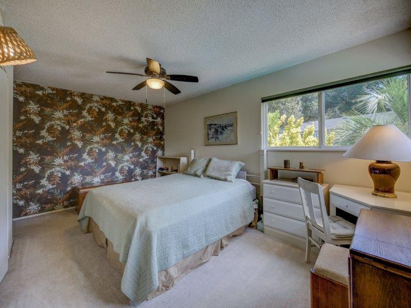224 Circle Drive Ben Lomond, CA 95005 - Photo 23 of 34 a spacious bedroom with a bed and a chandelier