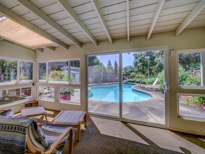 224 Circle Drive Ben Lomond, CA 95005 - Photo 6 of 34 a dining room with furniture water view and a floor to ceiling window