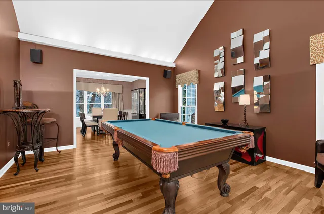 a kitchen with granite countertop a sink stove and refrigerator