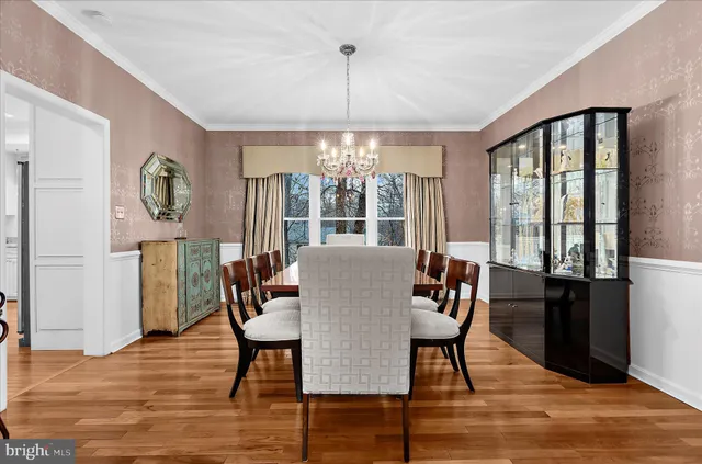a kitchen with kitchen island granite countertop a stove a sink and a refrigerator
