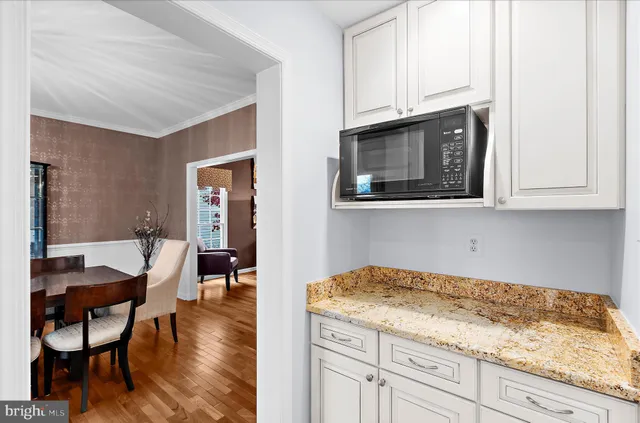 a kitchen with cabinets appliances and a window