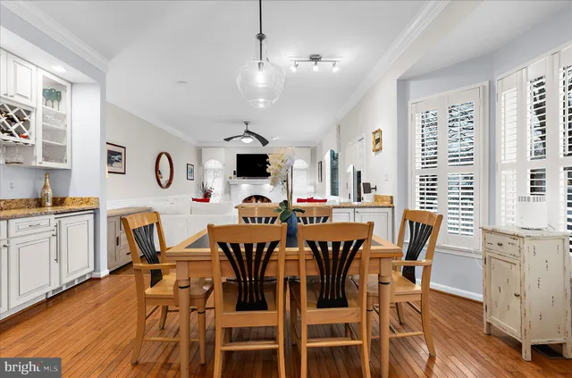 a spacious bedroom with a bed wooden floor and window