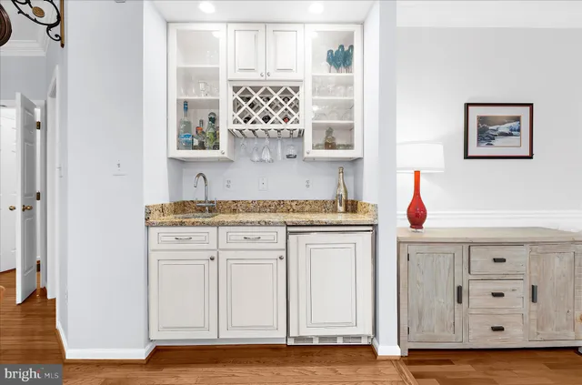 a bathroom with a tub shower and sink