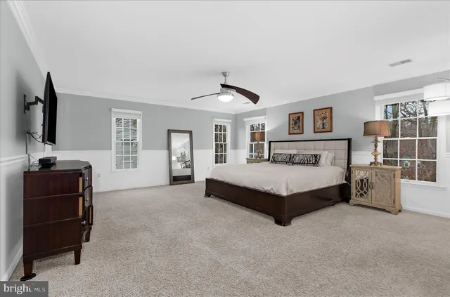 a view of a patio with table and chairs and wooden floor