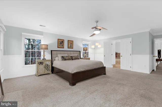 a view of a patio with table and chairs and wooden fence