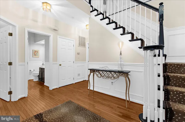 a room with pool table table and windows