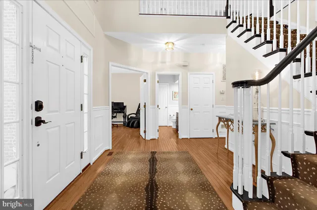 a room with pool table and windows