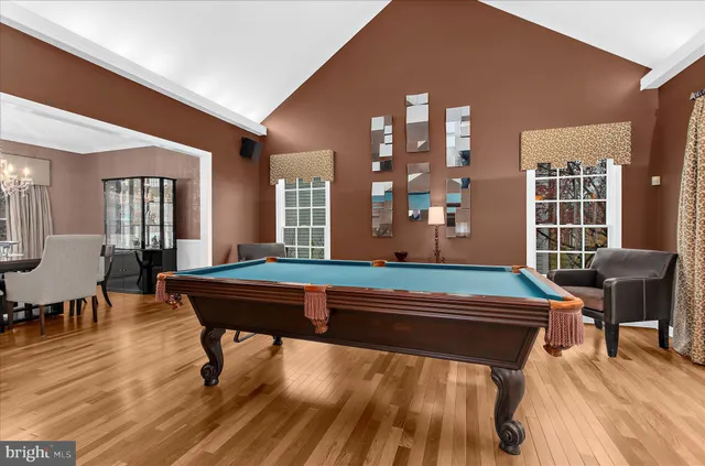 a large kitchen with stainless steel appliances granite countertop a sink stove and refrigerator