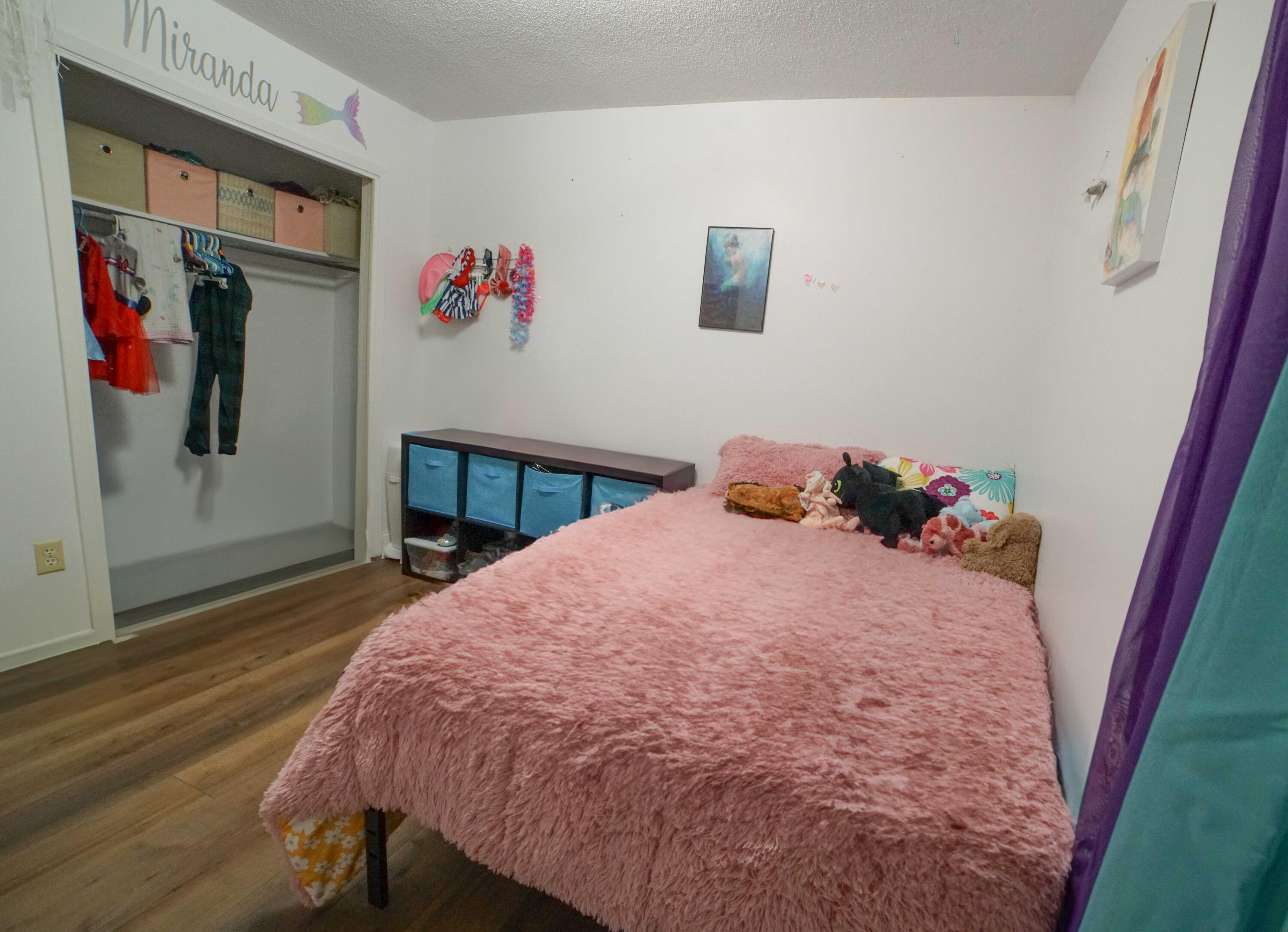 74 8th Street Shalimar, FL 32579 - Photo 18 of 26 a bed sitting in a bedroom next to a window