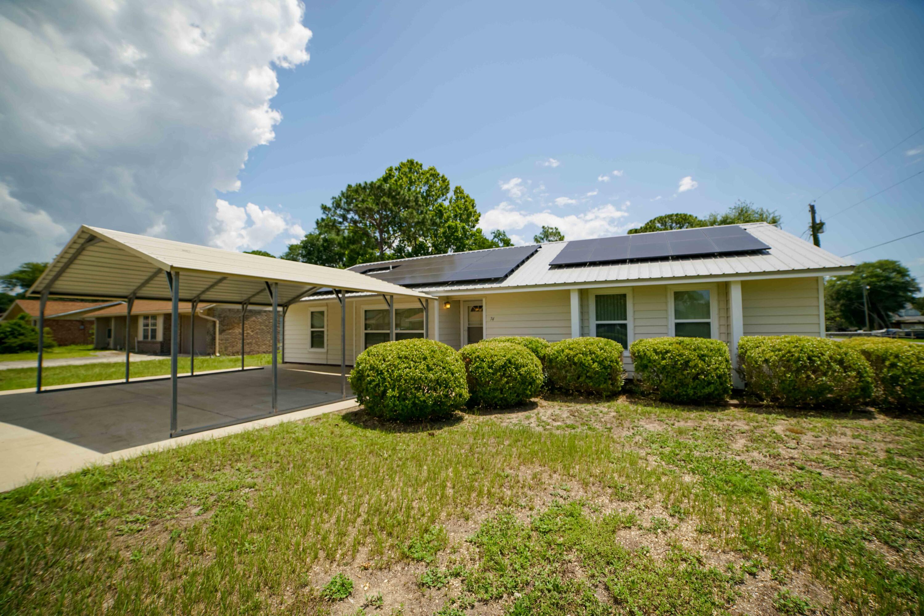 74 8th Street Shalimar, FL 32579 - Photo 25 of 26 a front view of house with yard and outdoor seating