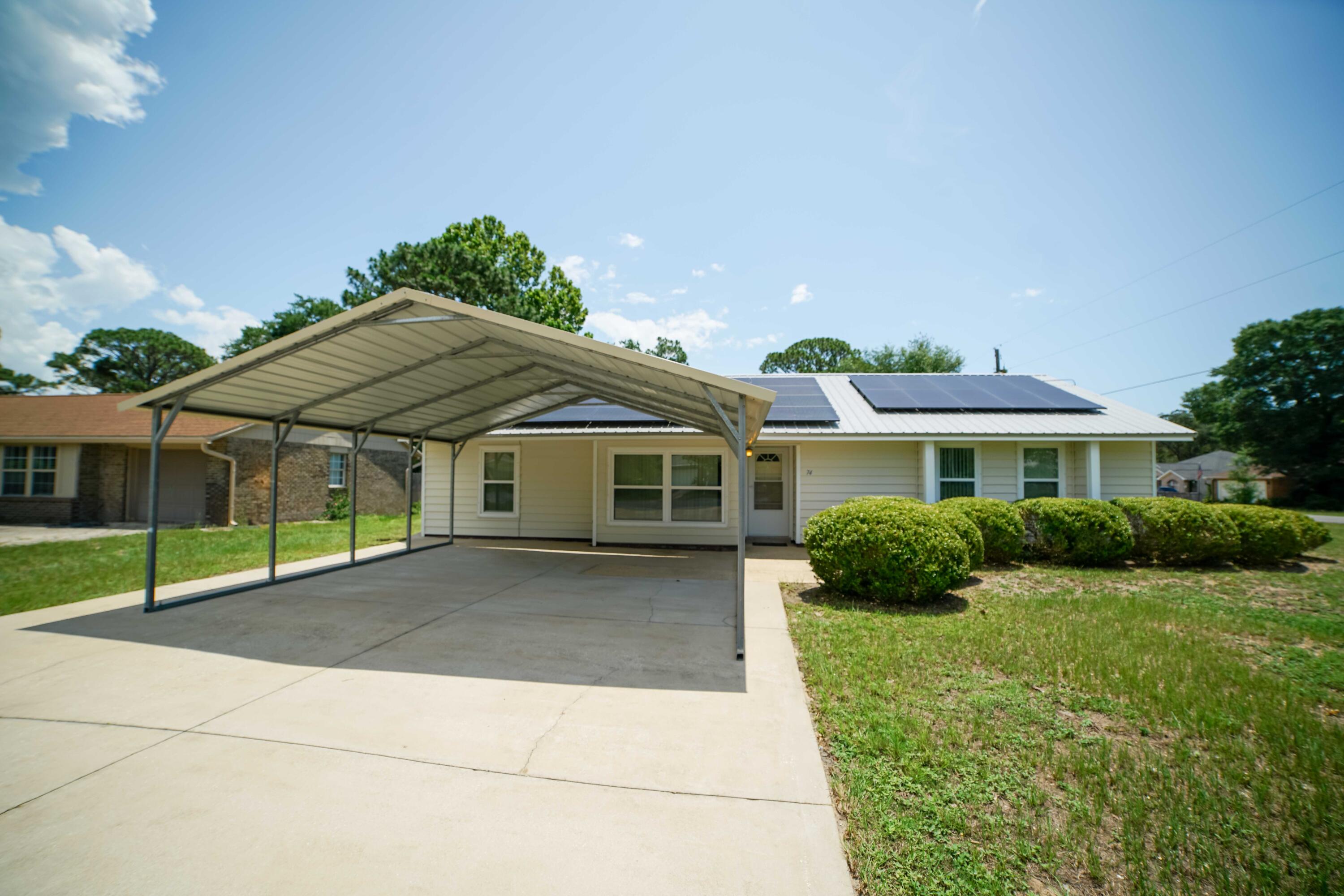 74 8th Street Shalimar, FL 32579 - Photo 26 of 26 a front view of a house with a yard