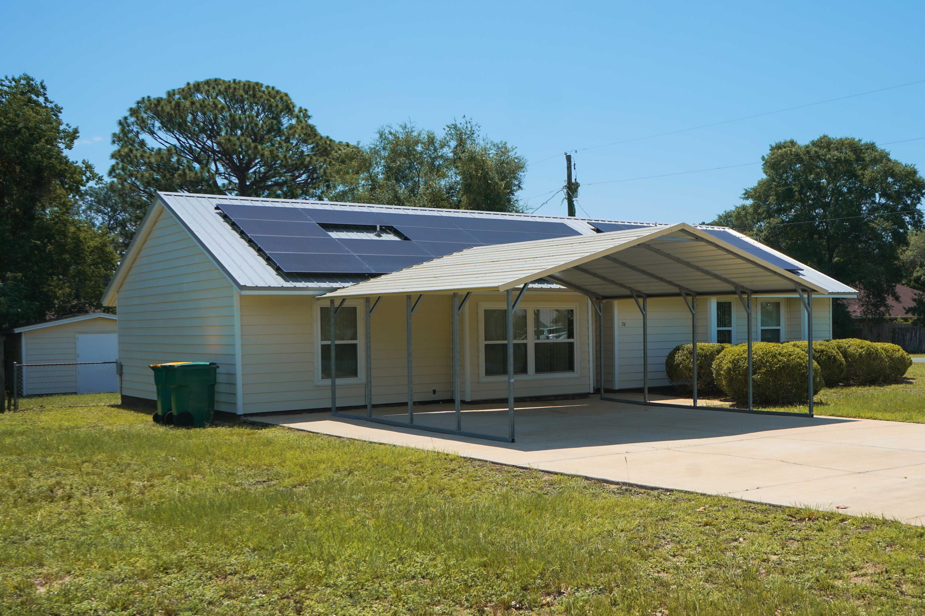 74 8th Street Shalimar, FL 32579 - Photo 3 of 26 a front view of a house with a yard