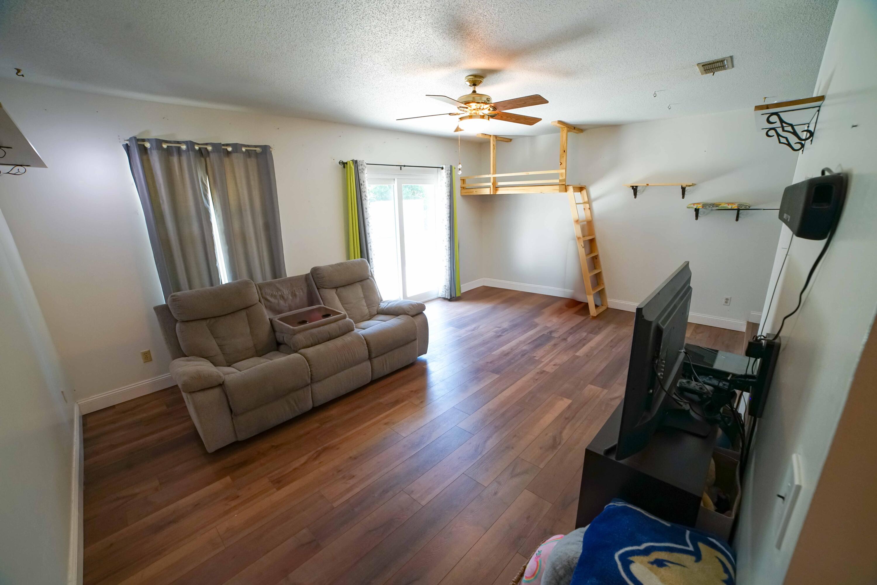 74 8th Street Shalimar, FL 32579 - Photo 5 of 26 a living room with furniture and wooden floor