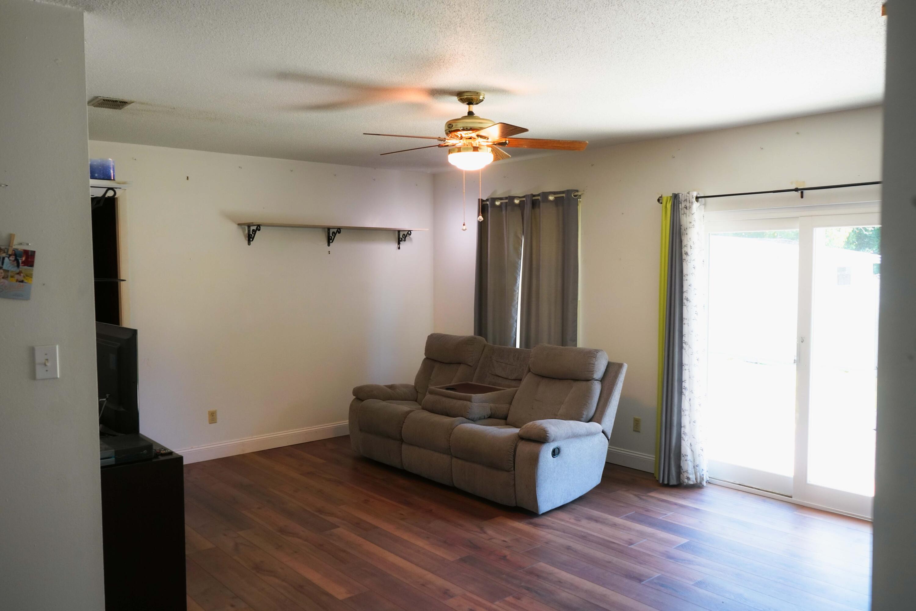 74 8th Street Shalimar, FL 32579 - Photo 6 of 26 a living room with furniture and a wooden floor