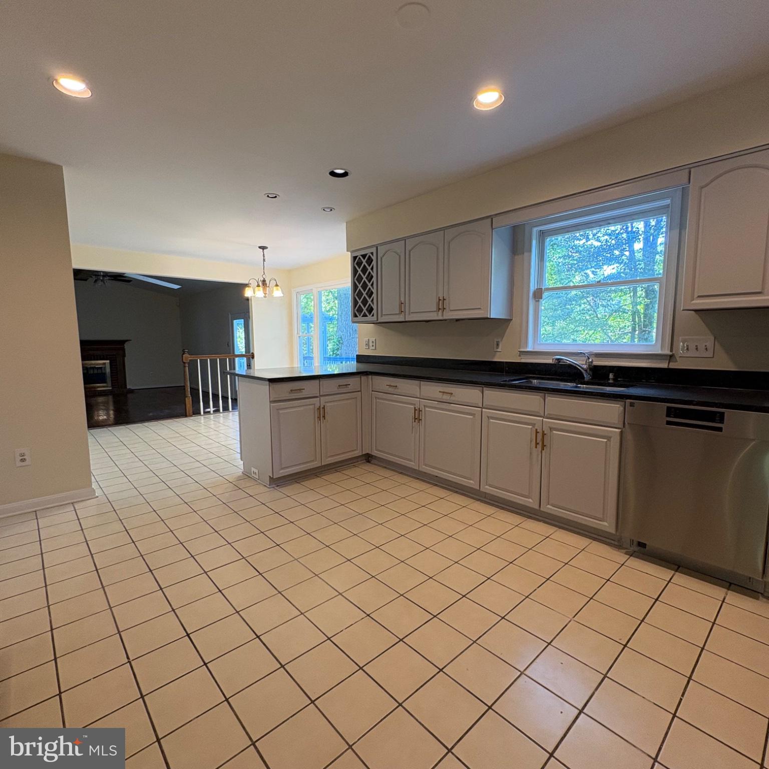 3502 Holly Road Annandale, VA 22003 - Photo 5 of 57 a kitchen with stainless steel appliances a sink window and cabinets