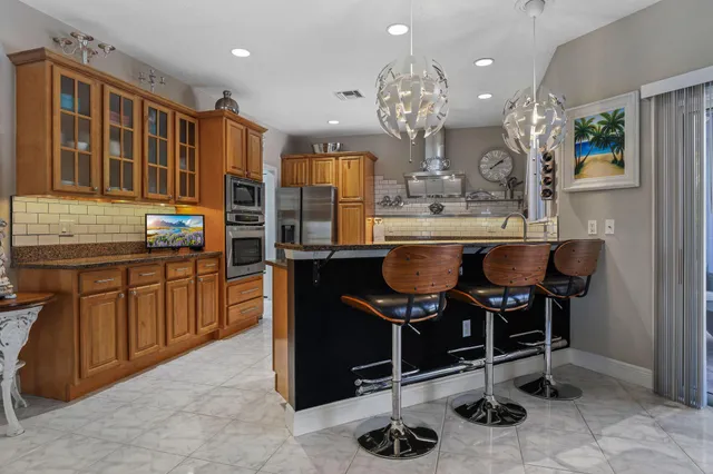 a bedroom with a bed dresser and a window