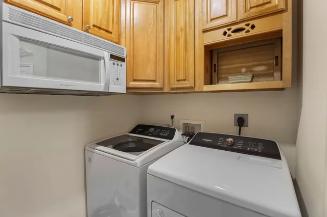 a bathroom with a sink mirror and shower