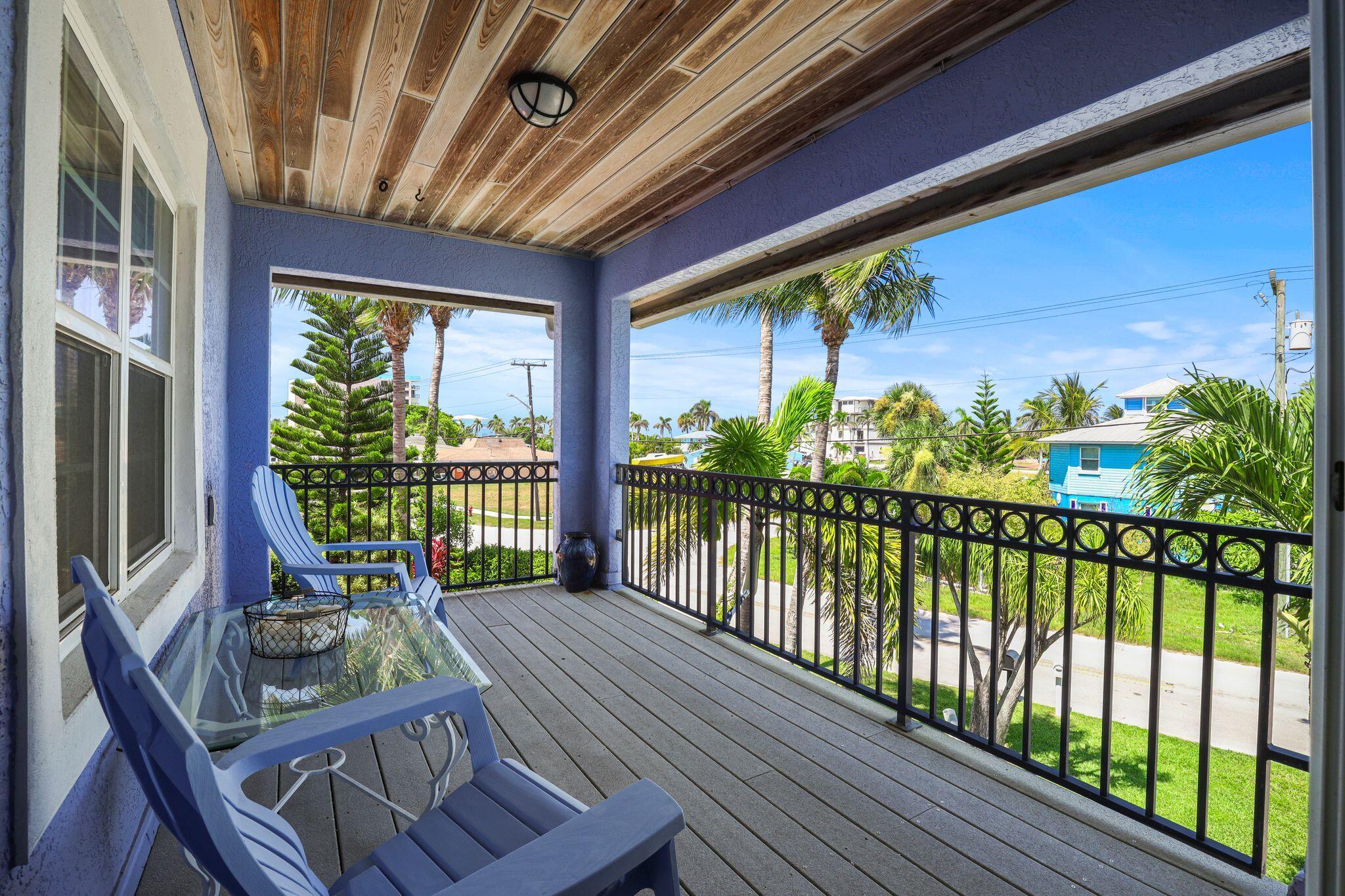 503 Hernando Street Fort Pierce, FL 34949 - Photo 52 of 96 a view of a porch with furniture and floor to ceiling window