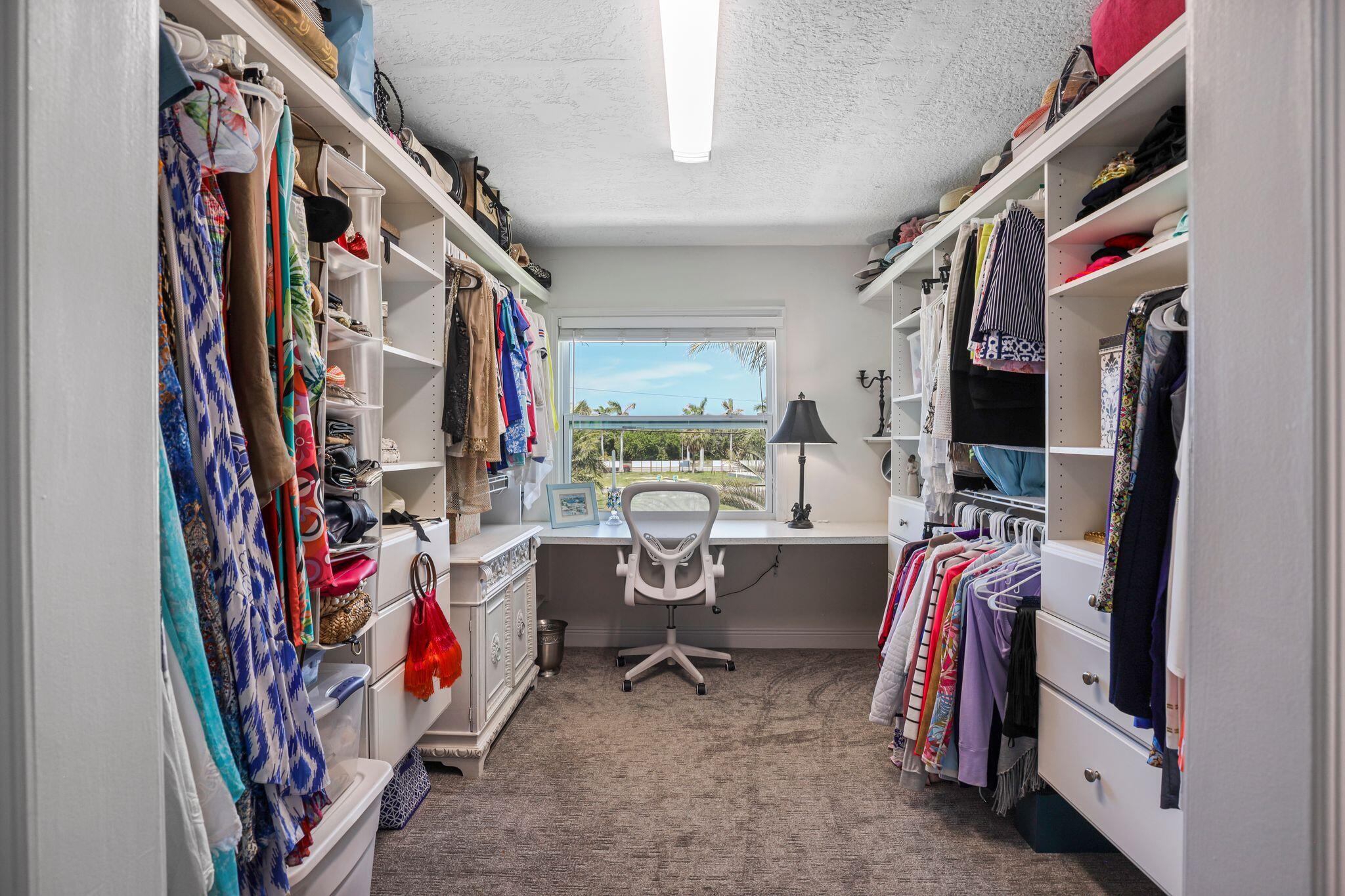 503 Hernando Street Fort Pierce, FL 34949 - Photo 55 of 96 a view of walk in closet with clothes