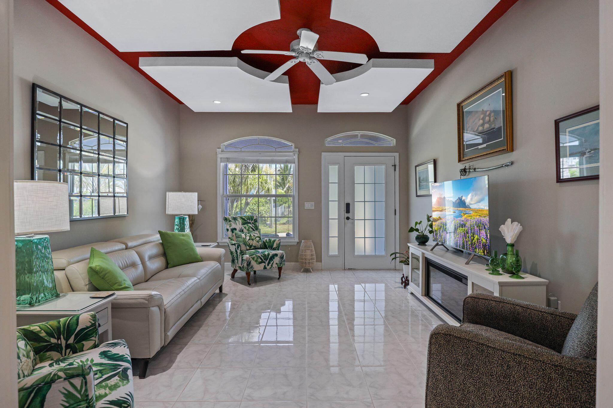 503 Hernando Street Fort Pierce, FL 34949 - Photo 7 of 96 a living room with furniture and a flat screen tv