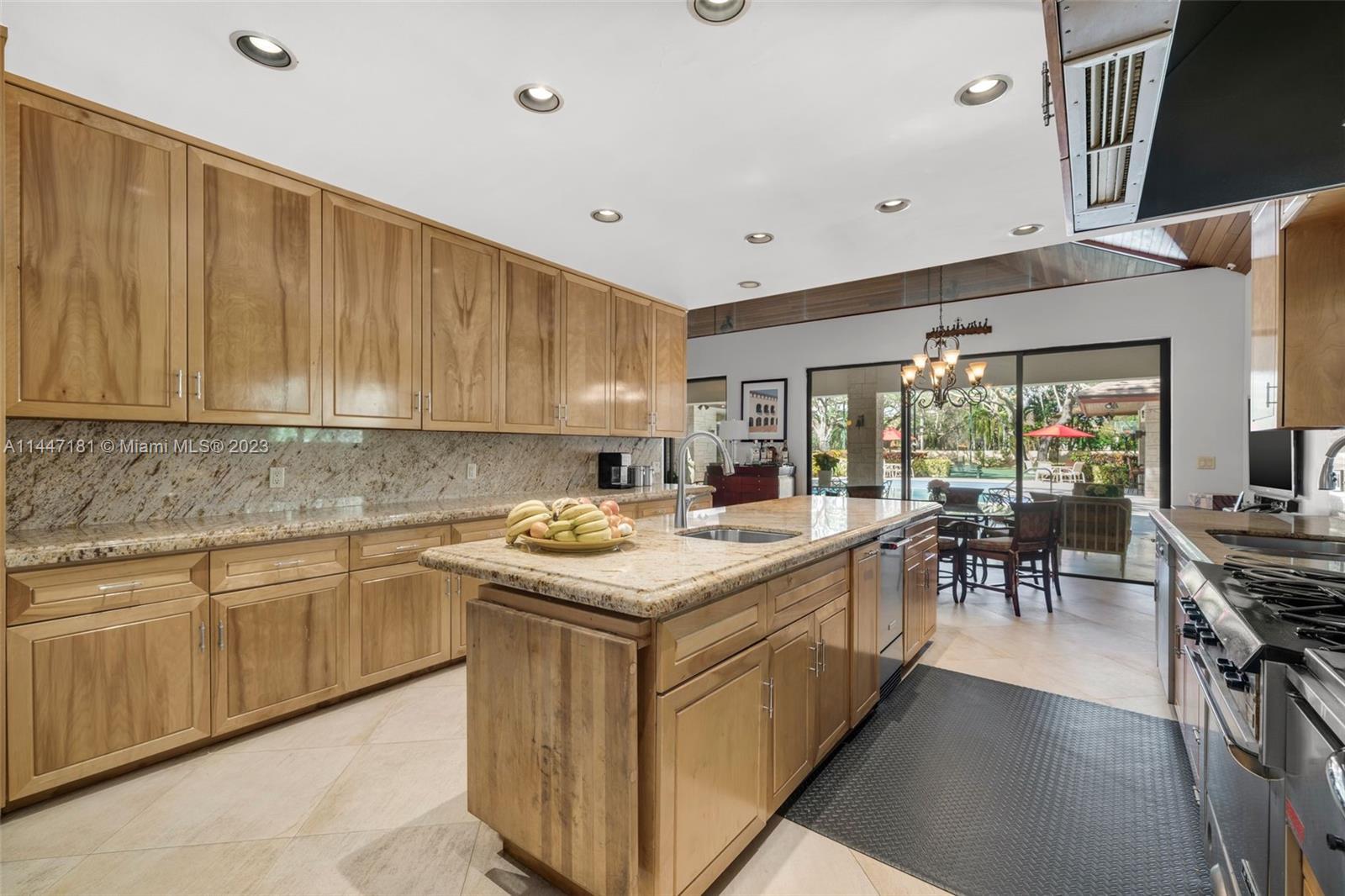 4875 Southwest 80th Street Miami, FL 33143 - Photo 14 of 52 a kitchen with a stove and a sink