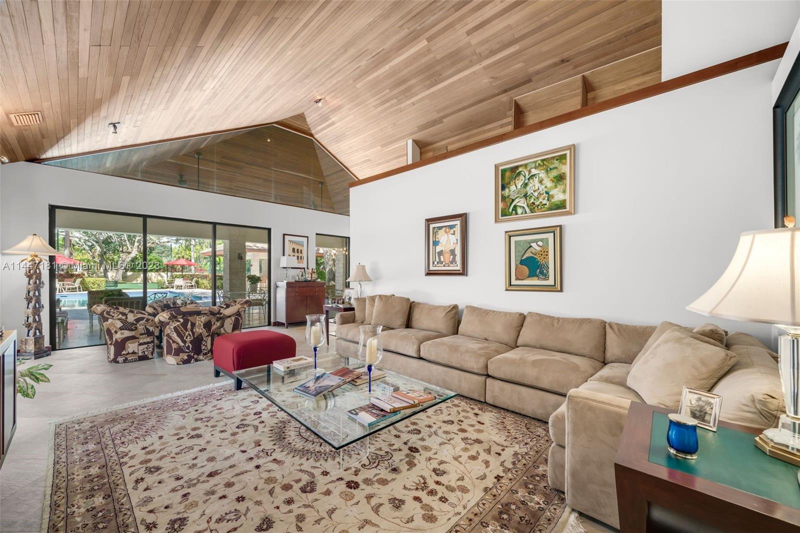 4875 Southwest 80th Street Miami, FL 33143 - Photo 16 of 52 a living room with furniture a couch and a large window