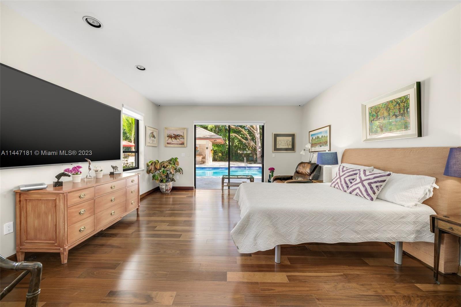 4875 Southwest 80th Street Miami, FL 33143 - Photo 23 of 52 a living room with furniture and a flat screen tv