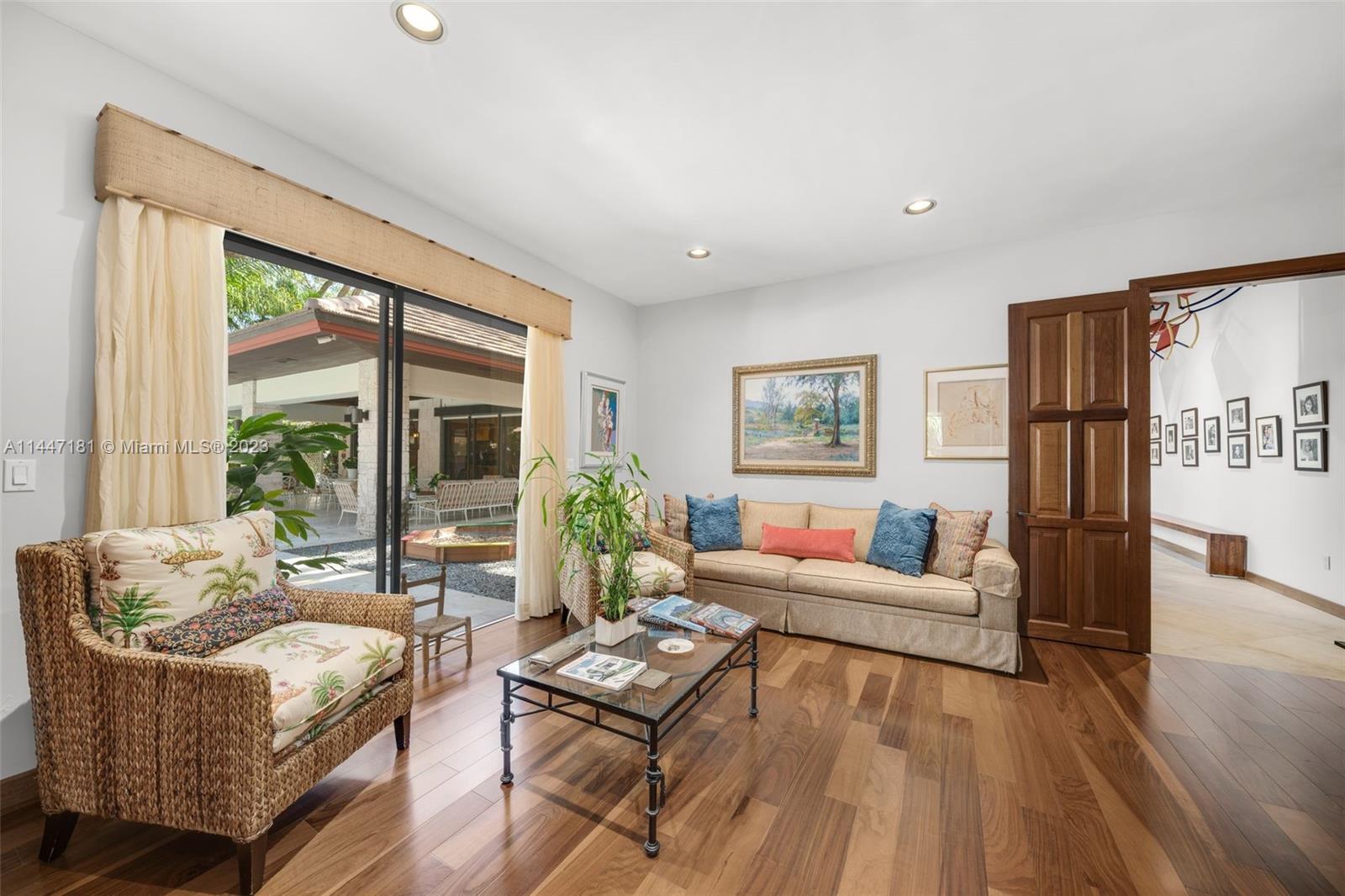 4875 Southwest 80th Street Miami, FL 33143 - Photo 24 of 52 a living room with furniture and a large window