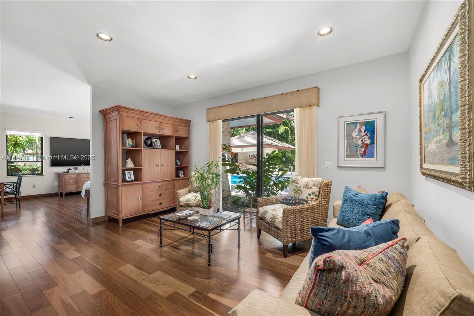 4875 Southwest 80th Street Miami, FL 33143 - Photo 25 of 52 a living room with furniture and a large window