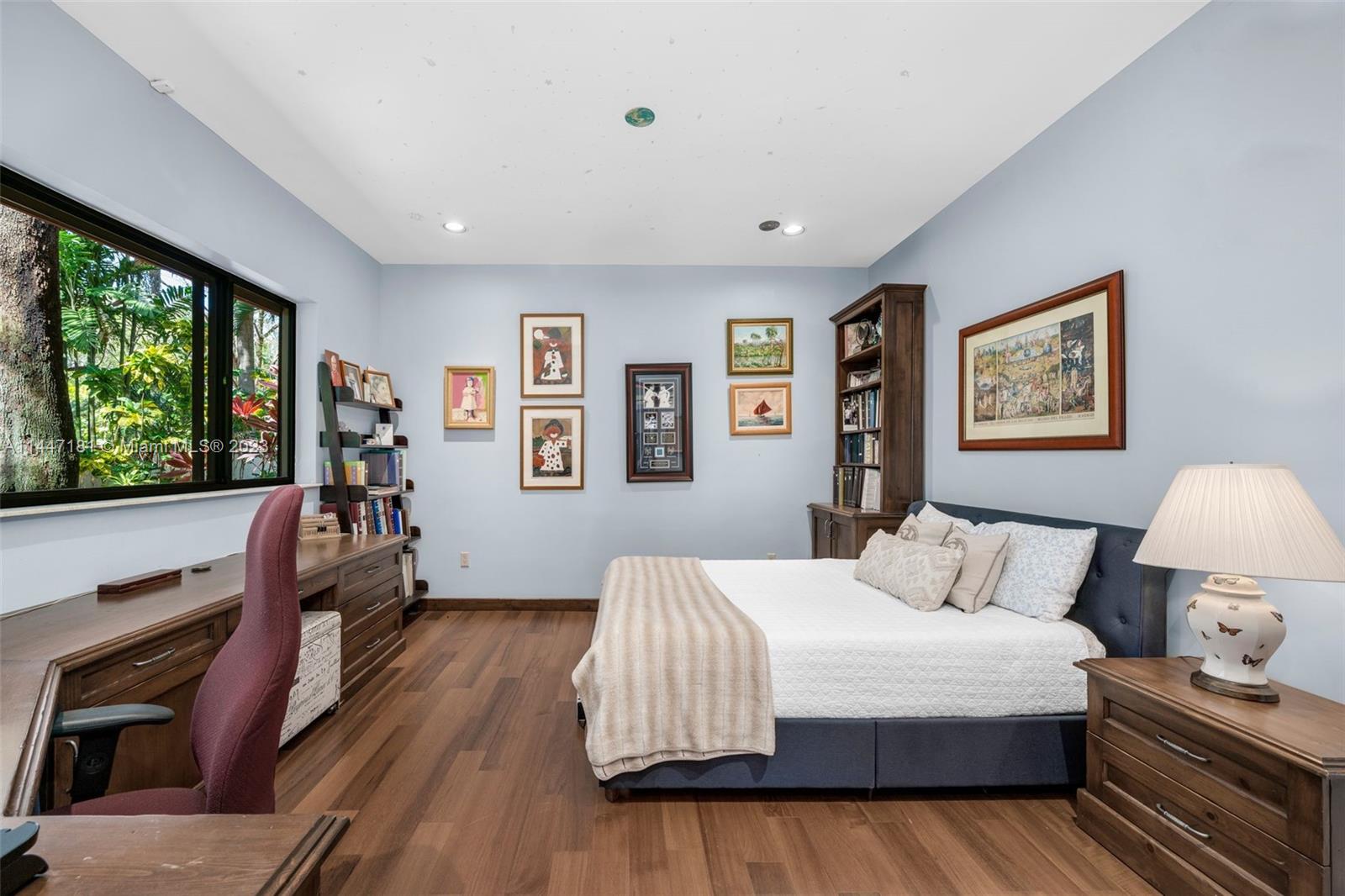 4875 Southwest 80th Street Miami, FL 33143 - Photo 26 of 52 a bedroom with a bed and wooden floor