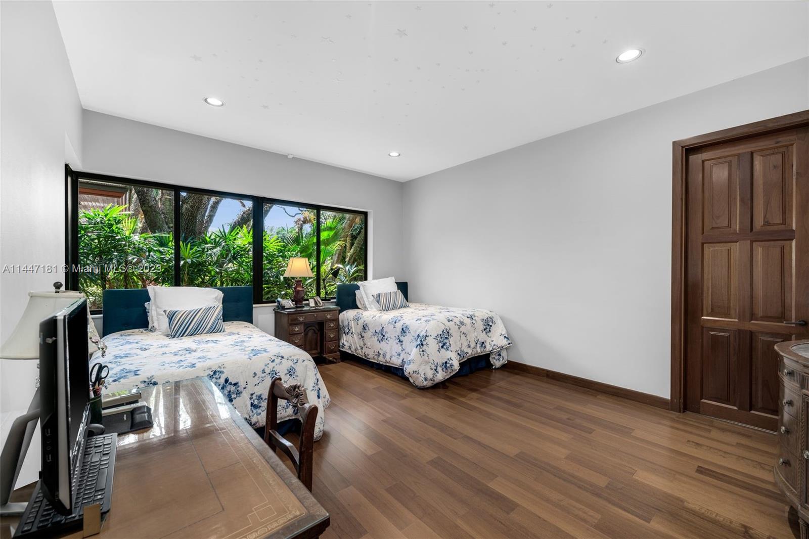 4875 Southwest 80th Street Miami, FL 33143 - Photo 32 of 52 a bedroom with a bed and large window