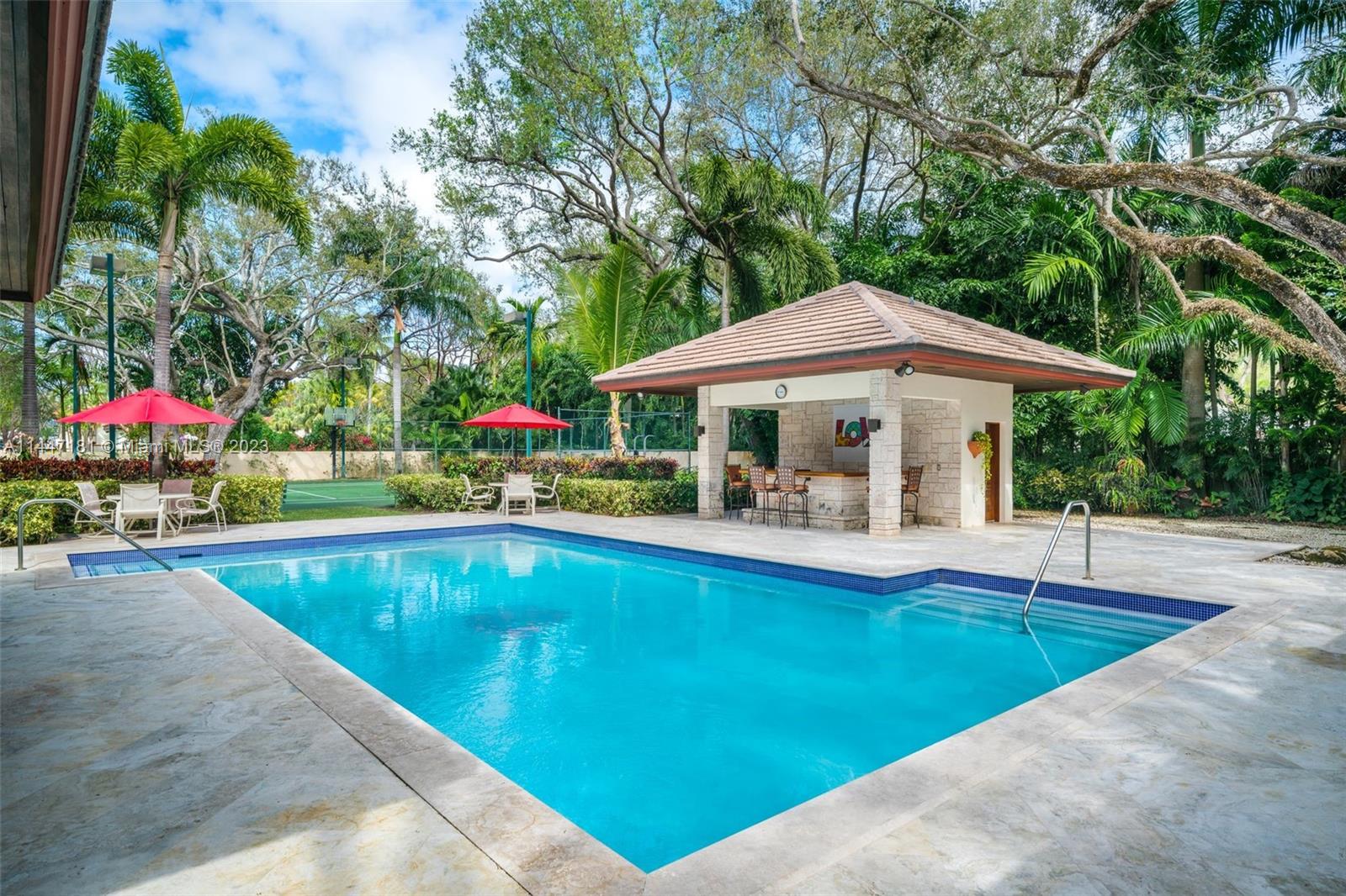 4875 Southwest 80th Street Miami, FL 33143 - Photo 36 of 52 swimming pool view with plants and large trees