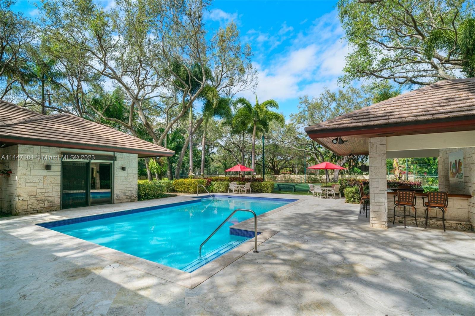 4875 Southwest 80th Street Miami, FL 33143 - Photo 38 of 52 a view of a swimming pool with a patio
