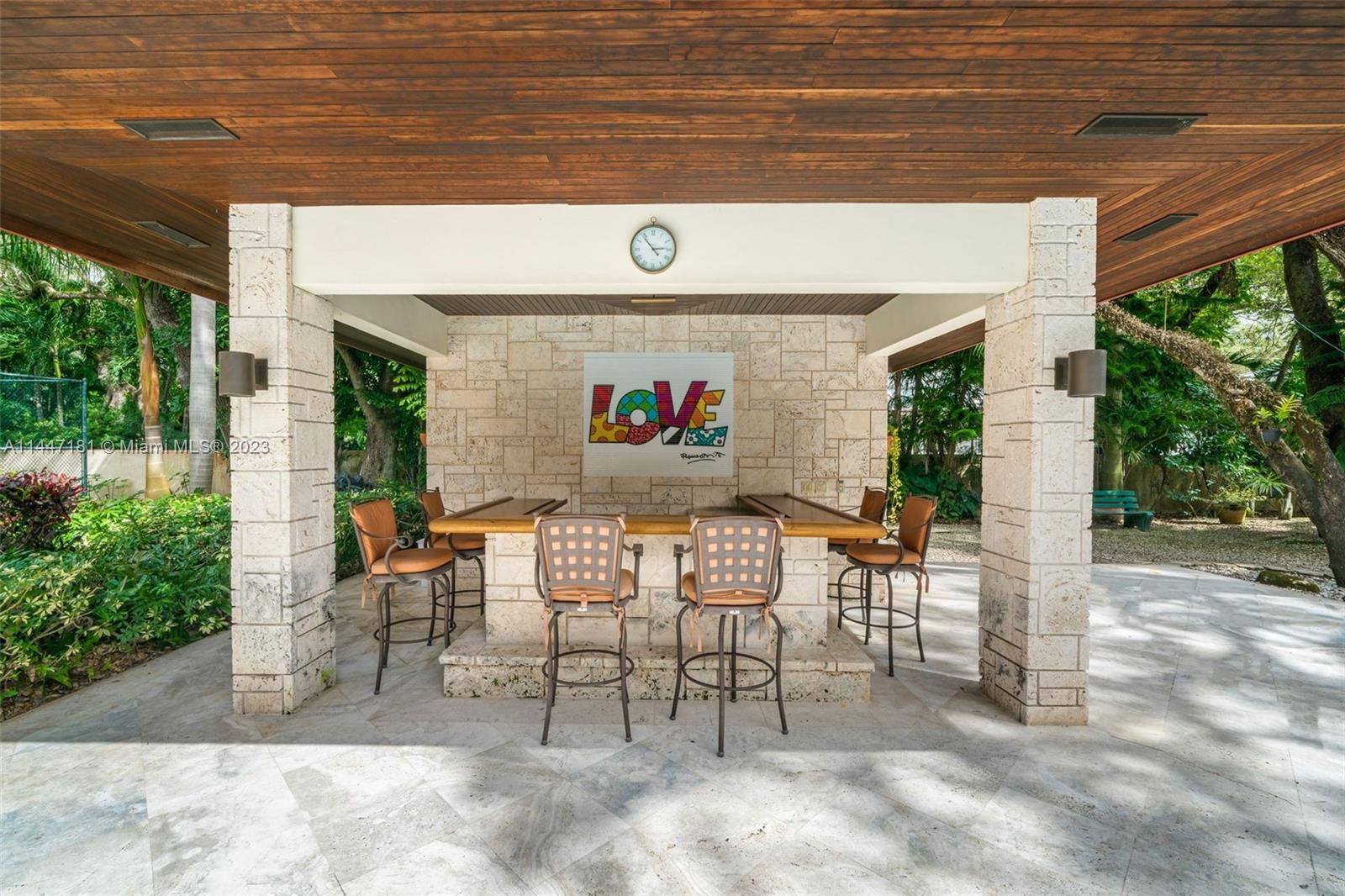 4875 Southwest 80th Street Miami, FL 33143 - Photo 40 of 52 a view of a patio with table and chairs and potted plants