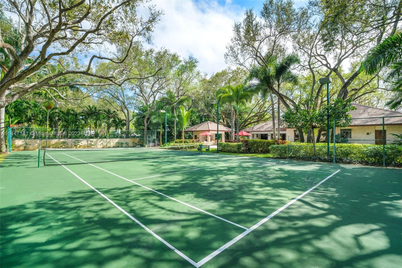 4875 Southwest 80th Street Miami, FL 33143 - Photo 41 of 52 a view of a white house with a big yard