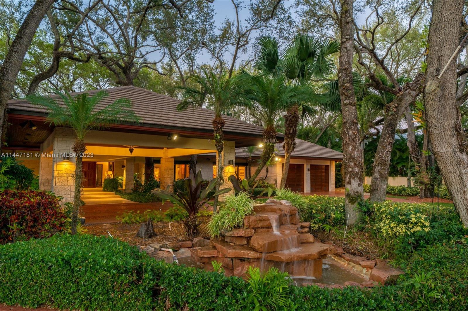 4875 Southwest 80th Street Miami, FL 33143 - Photo 45 of 52 front view of a house with a yard