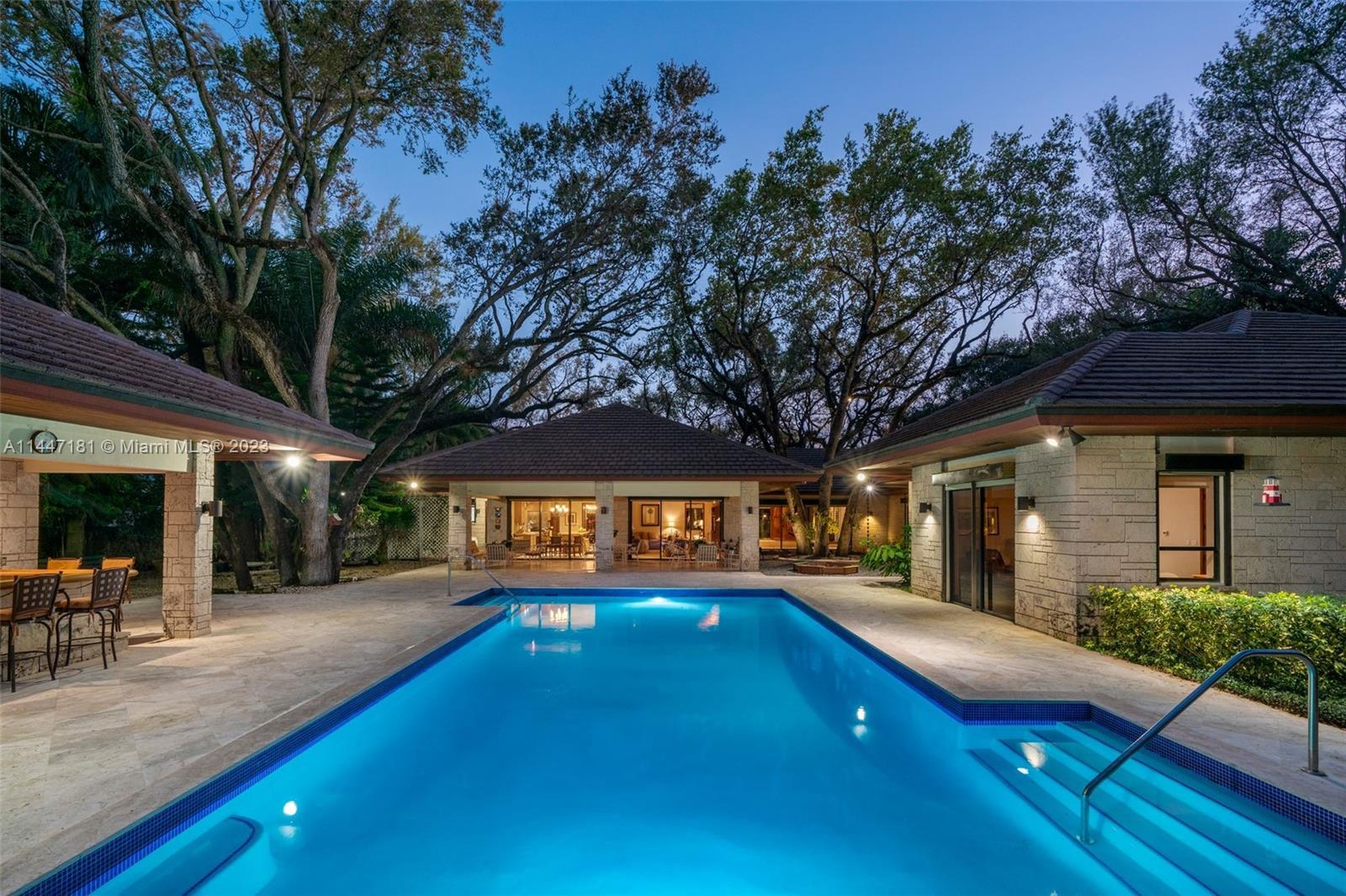4875 Southwest 80th Street Miami, FL 33143 - Photo 47 of 52 a view of an chairs and table on the patio