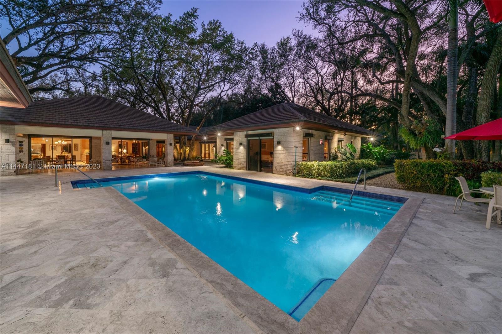 4875 Southwest 80th Street Miami, FL 33143 - Photo 49 of 52 a front view of house with yard and green space