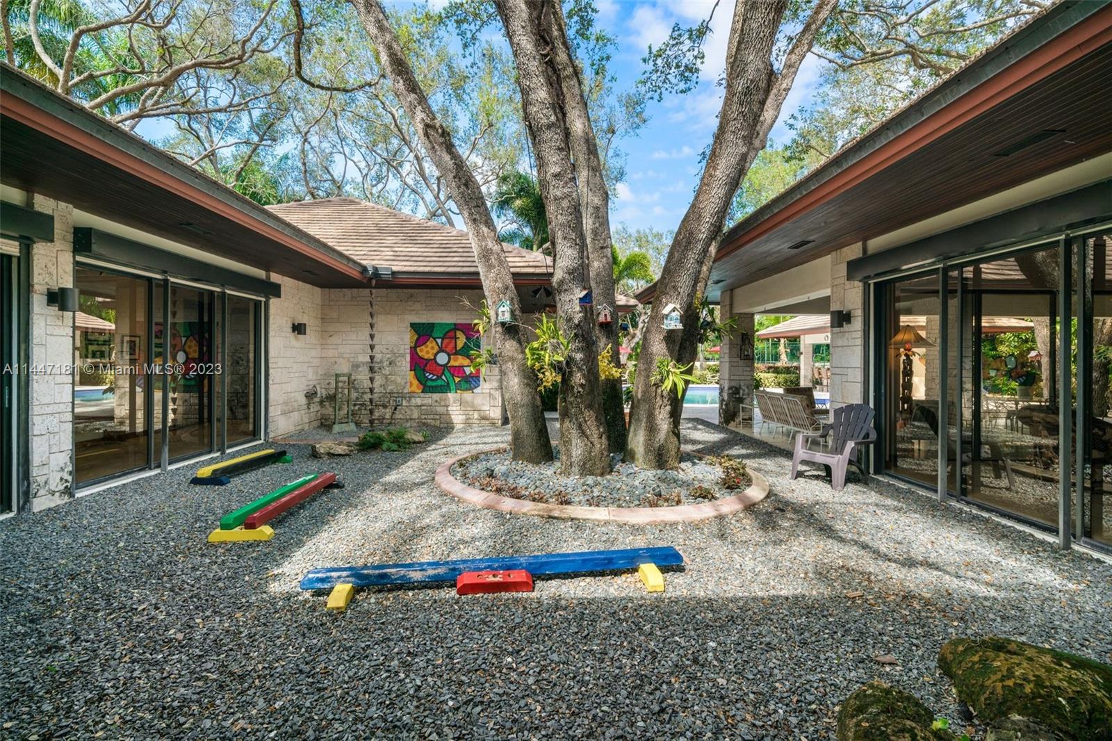 4875 Southwest 80th Street Miami, FL 33143 - Photo 6 of 52 a front view of house with outdoor seating