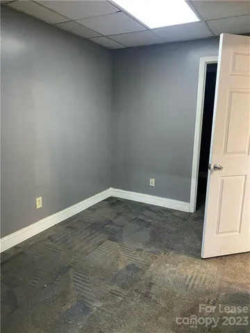 a room with a table and chairs