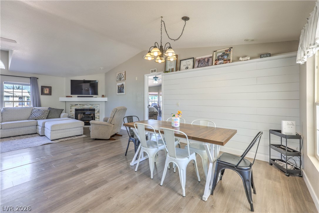 348 Tres Palomas Street Overton, NV 89040 - Photo 11 of 41 Hardwood floors flow through the dining and living areas, creating a spacious and unified feel.