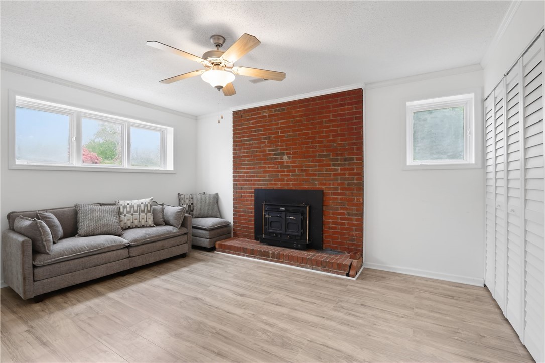 137 Towne Creek Trail Anderson, SC 29621 - Photo 18 of 23 This inviting room is multi-purpose and boasts a cozy fireplace, light flooring, a closet and ample natural light. Perfect as a 5th bedroom, office or peaceful retreat.