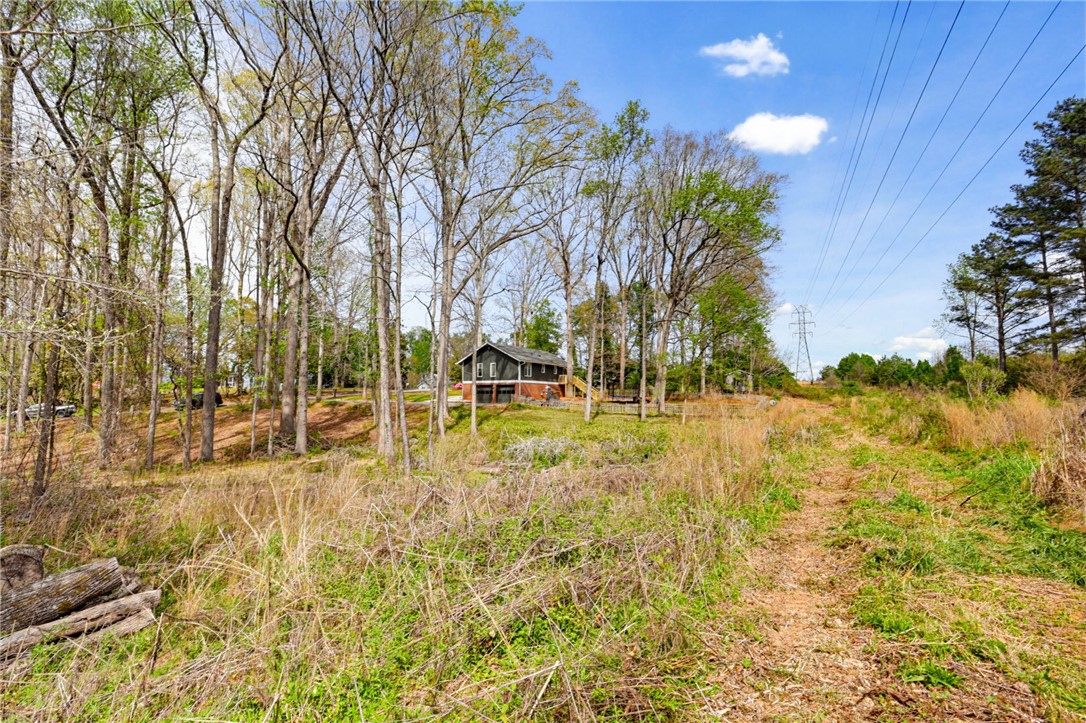 137 Towne Creek Trail Anderson, SC 29621 - Photo 22 of 23 This captivating 1.2 acre woodland retreat offers a private setting amidst natural beauty, perfect for peaceful living.