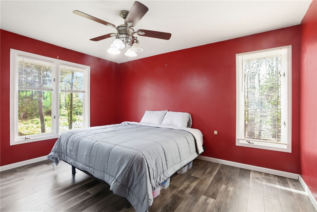 137 Towne Creek Trail Anderson, SC 29621 - Photo 9 of 23 This spacious primary bedroom offers ample natural light and durable flooring, perfect for comfortable living.