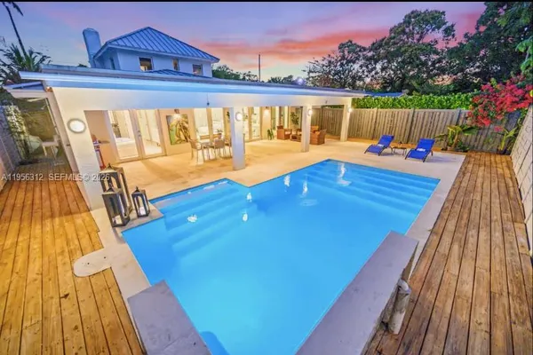 a view of swimming pool with seating space