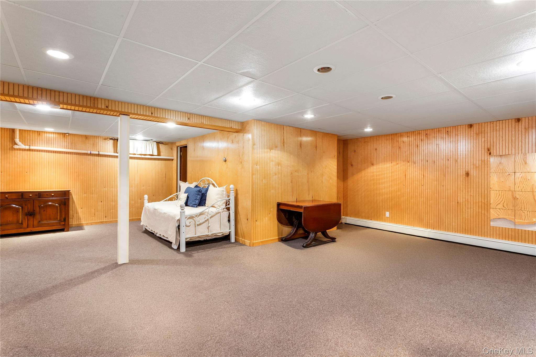 56 Seaman Road Riverhead, NY 11901 - Photo 2 of 9 a lobby with furniture and stairs