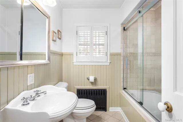 a bathroom with a toilet a sink and a bathtub