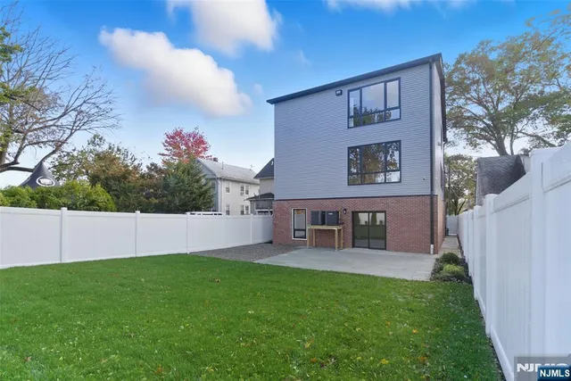 a view of a house with a yard porch and sitting area