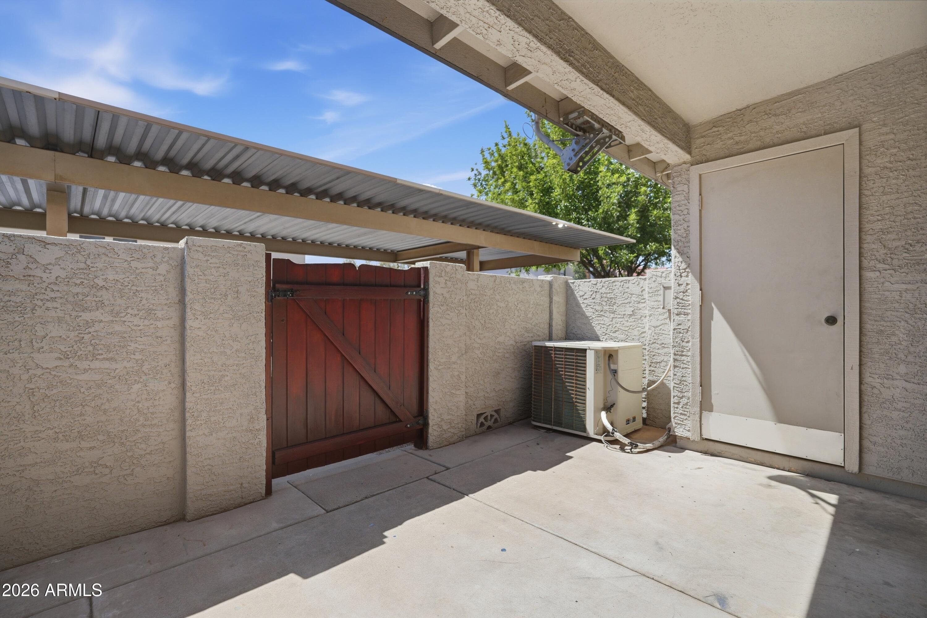 6262 East Brown Road, Unit 17 Mesa, AZ 85205 - Photo 28 of 37 Covered Patio & storage room